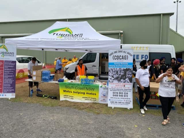 Members of the Sikh community provide support from the Milton showground.