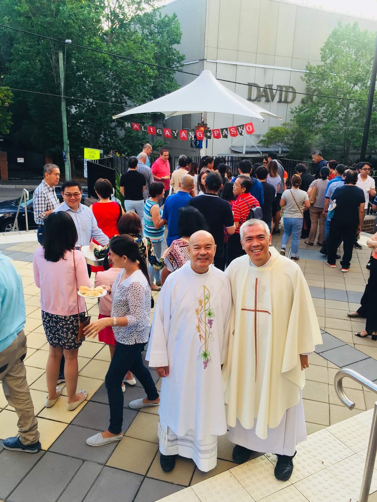 Deacon Roberto Corpuz, left, and Father Dado Haber at a Simbang Gabi celebration in Chatswood, Sydney. 