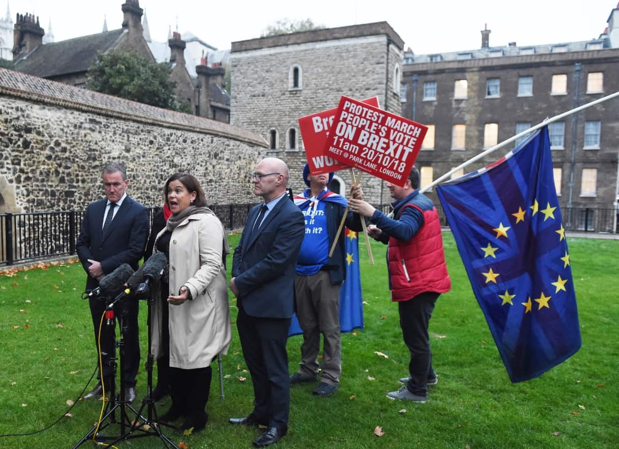 Sinn Fein's Conor Murphy (L) Sinn Fein Leader Mary Lou McDonald (C) and Michelle O'Neill, Sinn Fein's leader in Northern Ireland (C-L) speak to reporters