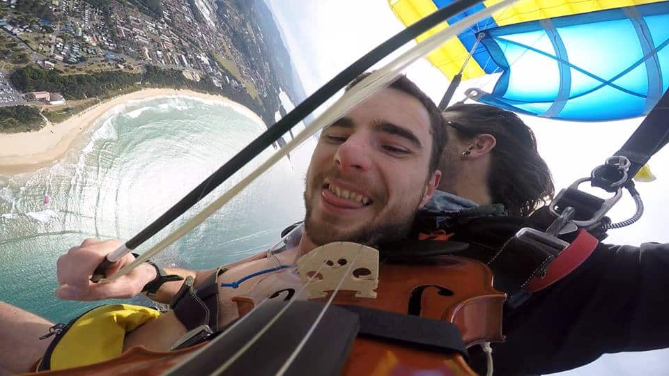 Glen Donnelly playing the violin while sky diving to raise money for charity.