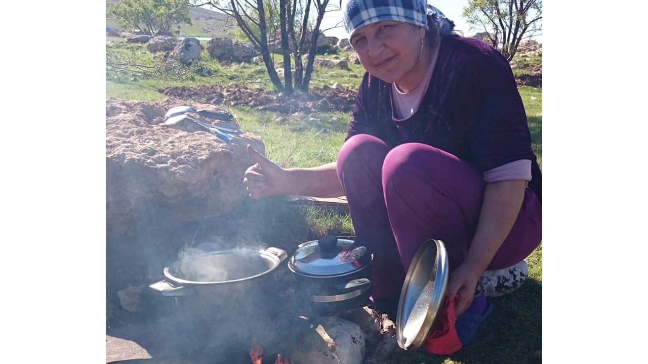 In Iraq, Sabeeha cooked on an open fire for her family. 