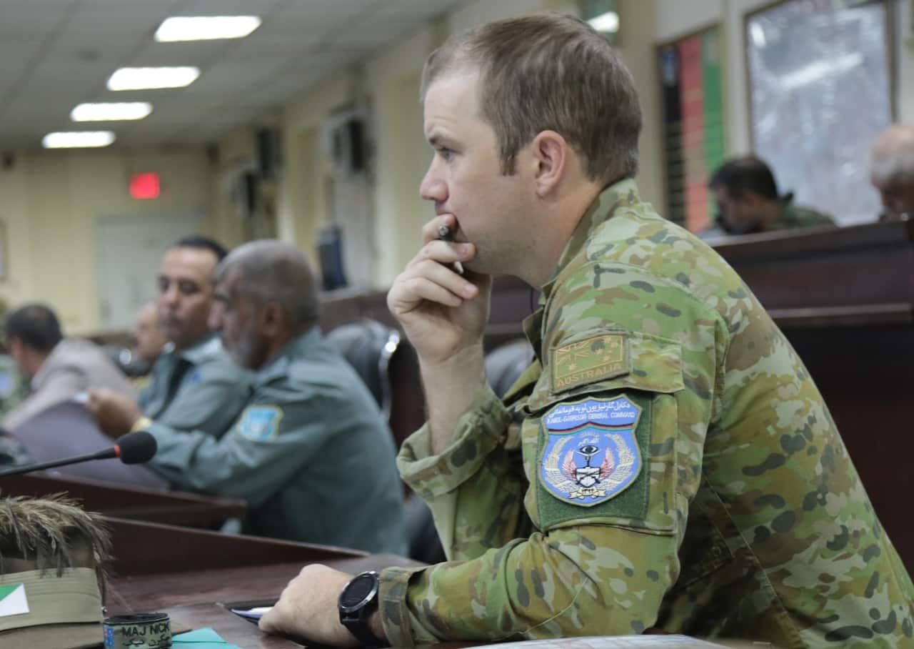 Major Nick Rutten observes a meeting in the KGC (SBS)