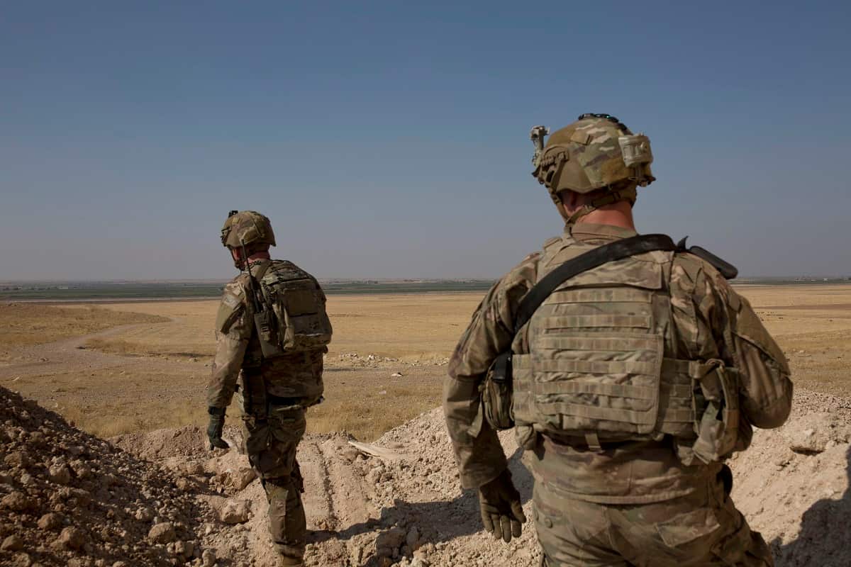 U.S. soldiers survey the the safe zone between Syria and the Turkish border near Tal Abyad, Syria, on a joint patrol, Friday, Sept. 6, 2019. 