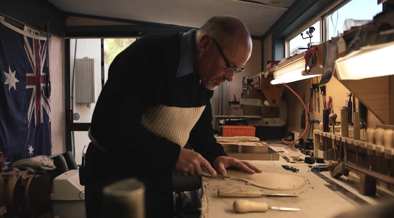 Peter Reid builds instruments in a shed behind his home in Orange, NSW. 