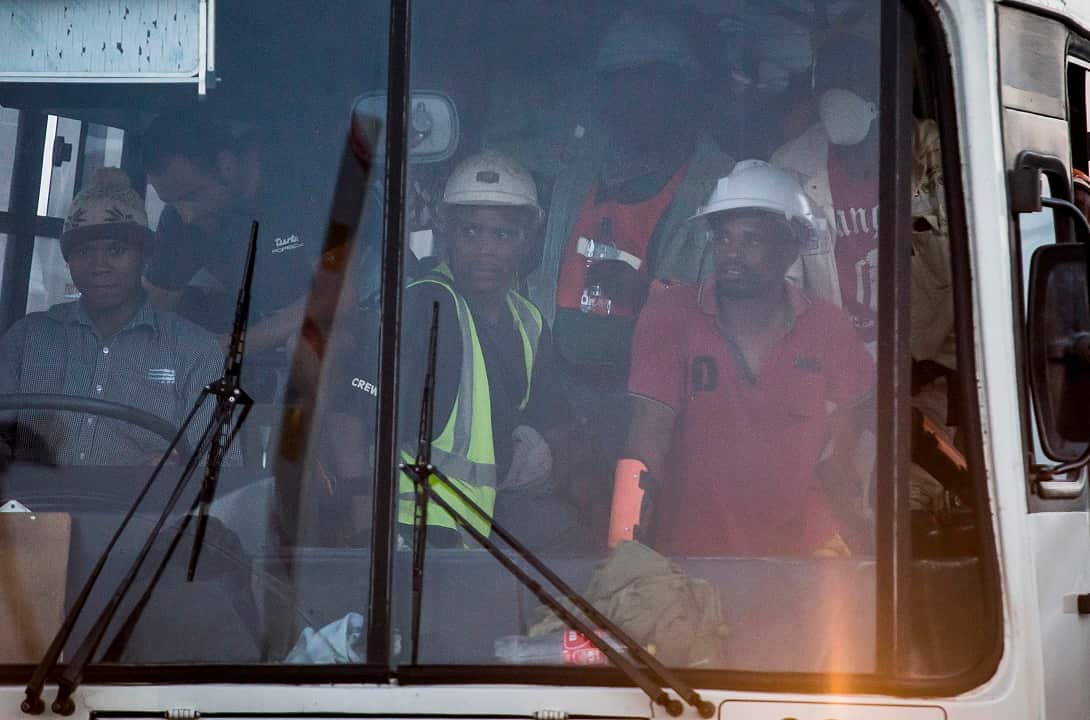 A bus, carrying some of the more than 900 rescued miners, transports them from the Sibanye-Stillwaters Beatrix mine near Welkom, South Africa.