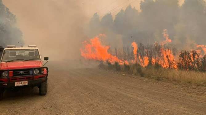 Firefighters battle bushfires in Tasmania. 