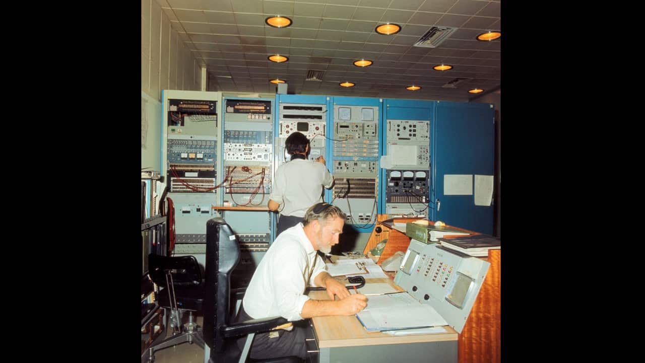 Technicians work at Honeysuckle Creek.  