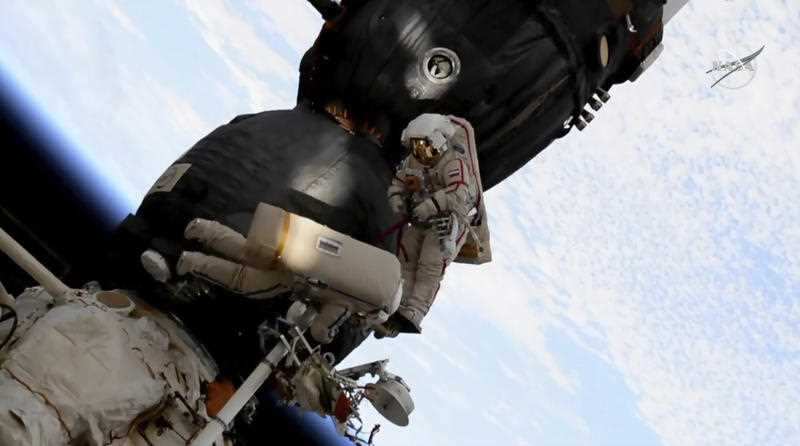 Russian cosmonaut Oleg Kononenko, right, and Sergei Prokopyev perform a spacewalk outside the Soyuz spacecraft attached to the International Space Station.