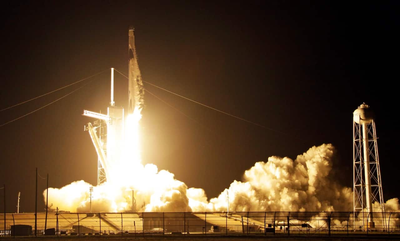 A SpaceX Falcon 9 rocket with a demo Crew Dragon spacecraft lifts off from pad 39A on an uncrewed test flight to the International Space Station