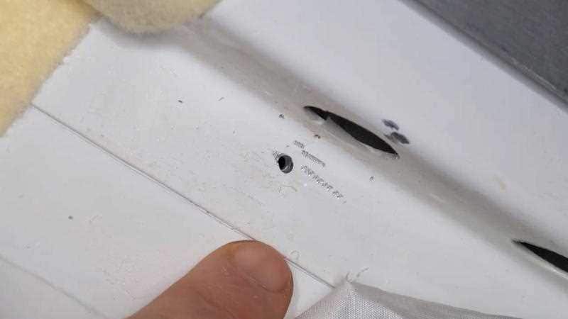 An undated handout photo made available by NASA showing a hole in a Russian spaceship docked at the ISS.
