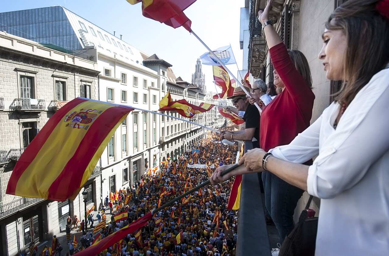Protesters wave flags during a demonstration called by Societat Civil Catalana (Catalan Civil Society) (AAP)