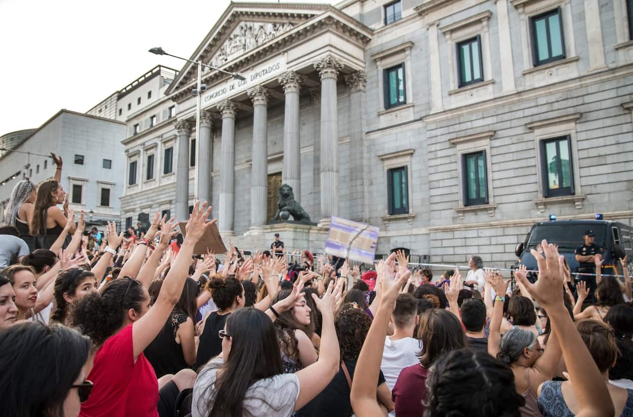 Demonstrators attend a rally in Madrid, Spain on June 22, 2018, one day after a court ordered the release on bail of five men