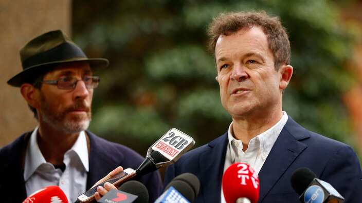 Attorney General Mark Speakman and plaintiff John Ellis.