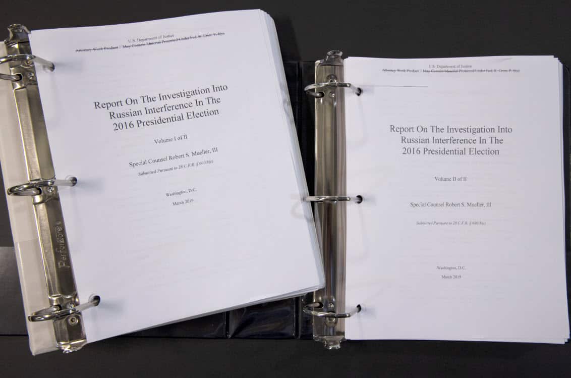 Special counsel Robert Mueller's redacted report on the investigation into Russian interference in the 2016 presidential election is photographed Thursday, April 18, 2019, in Washington. The report contained two volumes. (AAP)