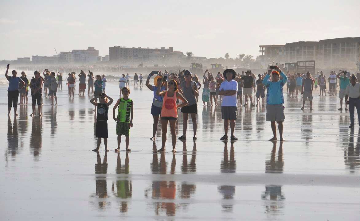 Crowds of people, reminiscent of shuttle launch days, line the beaches of Cape Canaveral and Cocoa Beach to watch the launch of the SpaceX Falcon Heavy.