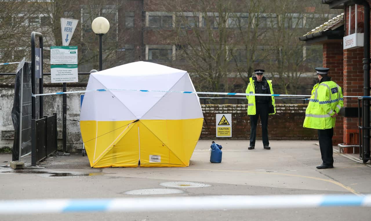 Police stand guard in Salisbury where Sergei Skripal, 66, and his daughter were poisoned. 