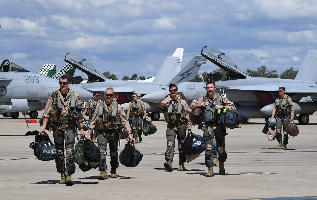 Pilots from No.1 Squadron are seen after landing Super Hornet strike aircraft at the RAAF Base Amberley, west of Brisbane.