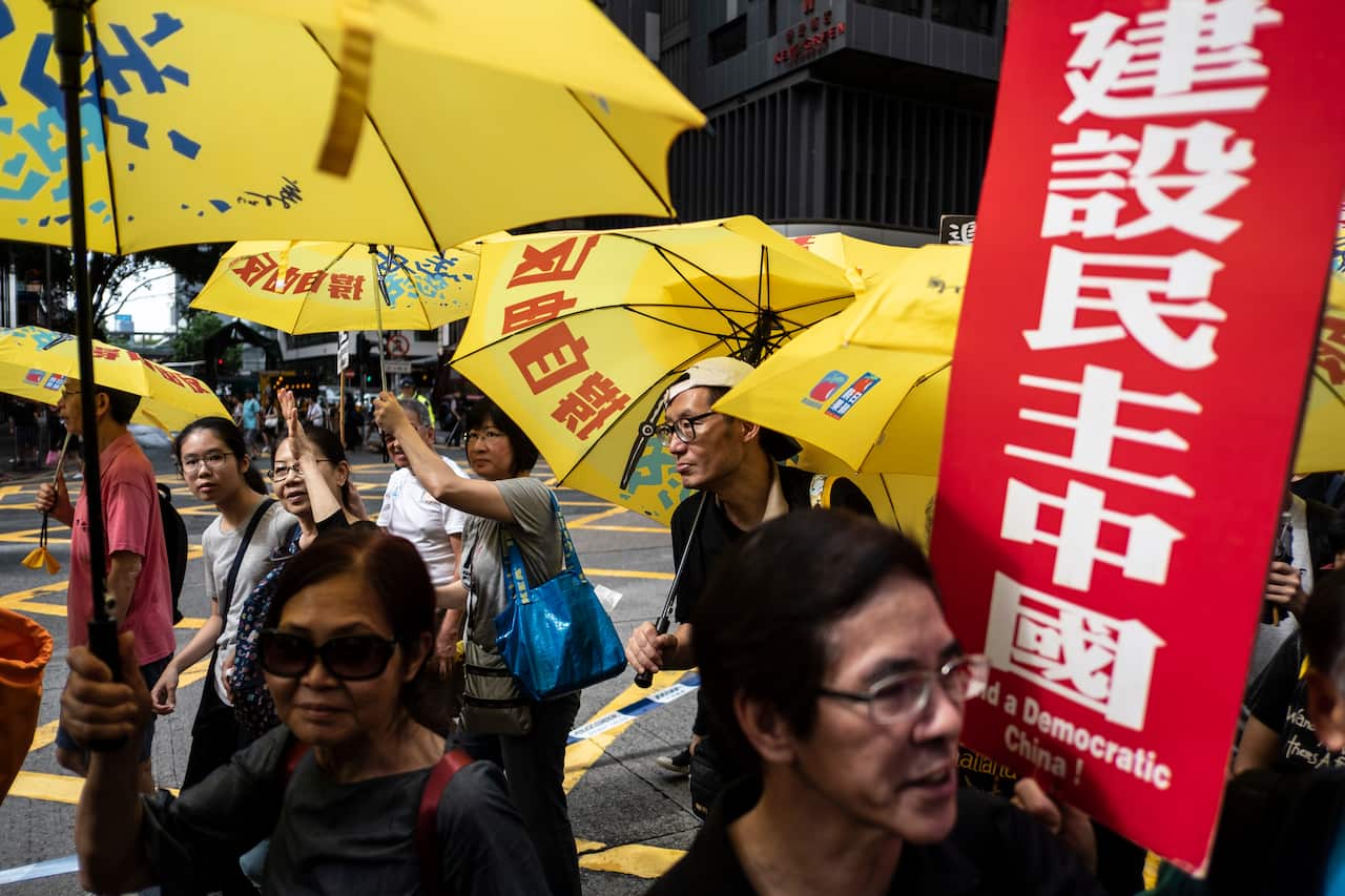 Pro-democracy participants attend the protest commemorating the 30th anniversary of the 1989 Tiananmen Square crackdown in Hong Kong.