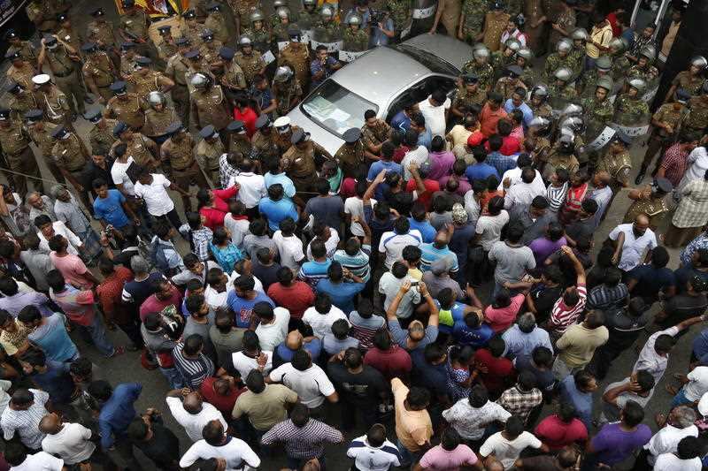 A minister's security detail opened fire, injuring three persons, while one died of his injuries in hospital later.