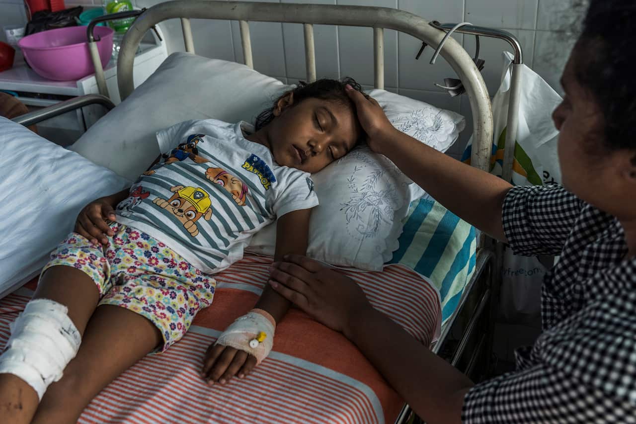 S. Diduni Nihansa, who was wounded in the Easter Sunday bombing at St. Sebastians Church, is comforted by a relative in a hospital in Colombo, Sri Lanka.