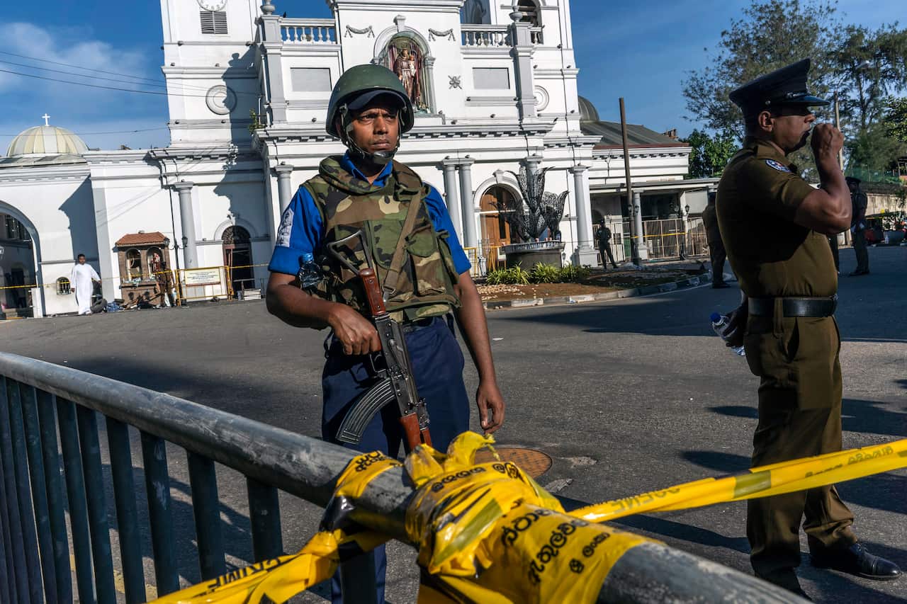Sri Lankan military and police outside St. Anthony's Shrine in Colombo on Monday, April 22, 2019, one day after a suicide bomb attack on the church.