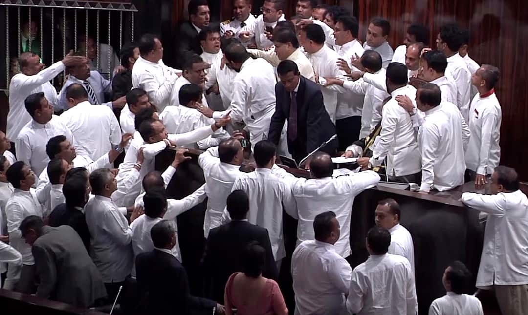 Sri Lanka's lawmakers scuffle at the parliament in Colombo. 