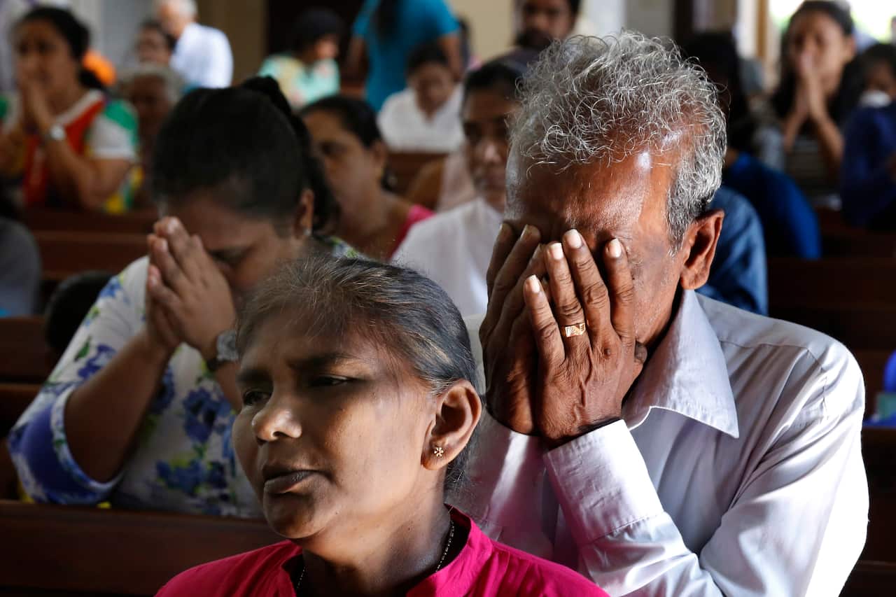 Sri Lankan Catholics pray during mass which resumed after the Easter Sunday attacks, at the 'All Saints' Church in Colombo.