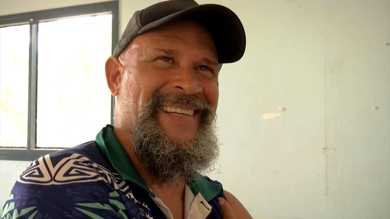 Herbert Warusam getting a COVID-19 vaccine