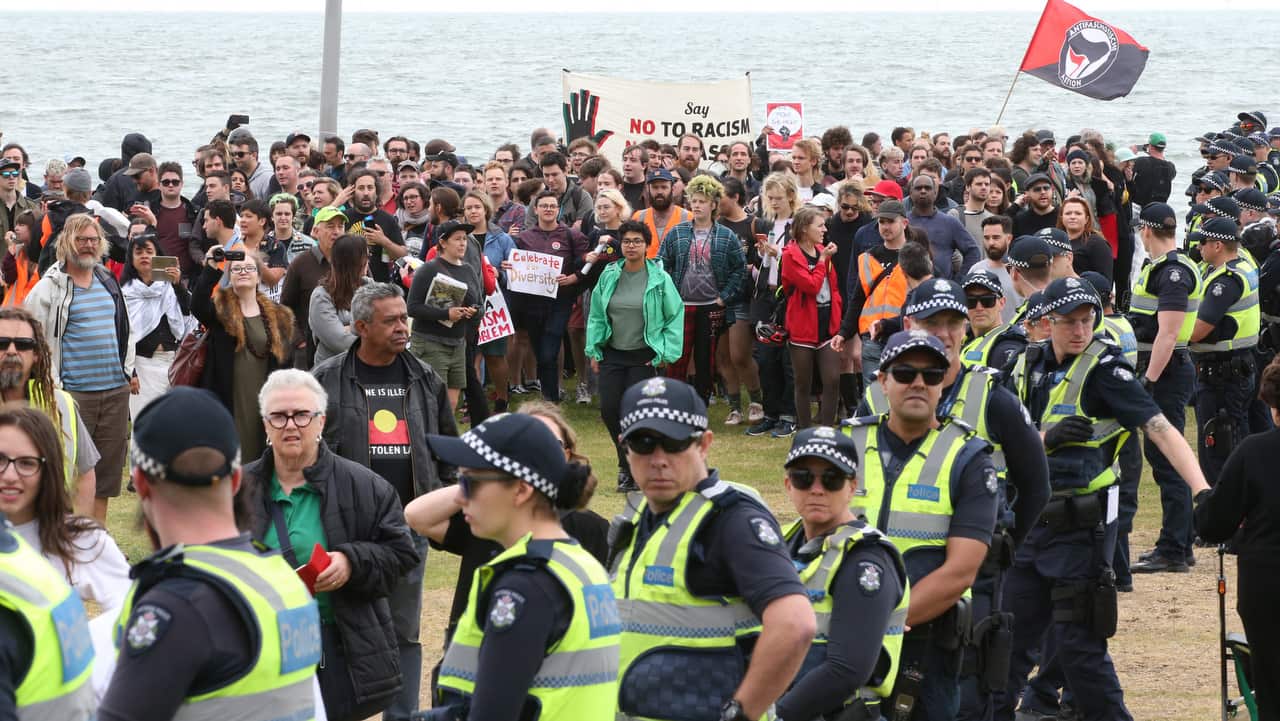 Police on keep protesters apart on the St Kilda foreshore in Melbourne, Saturday, January 5, 2019.  