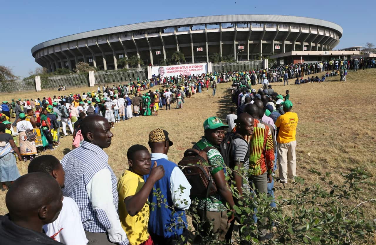 People queue to enter the stadium for the inauguration ceremony of Zimbabwean President Emmerson Mnangagwa, at the National Sports Stadium in Harare