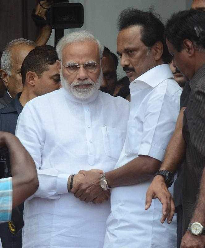 M.K. Stalin shakes  Modis hand.
