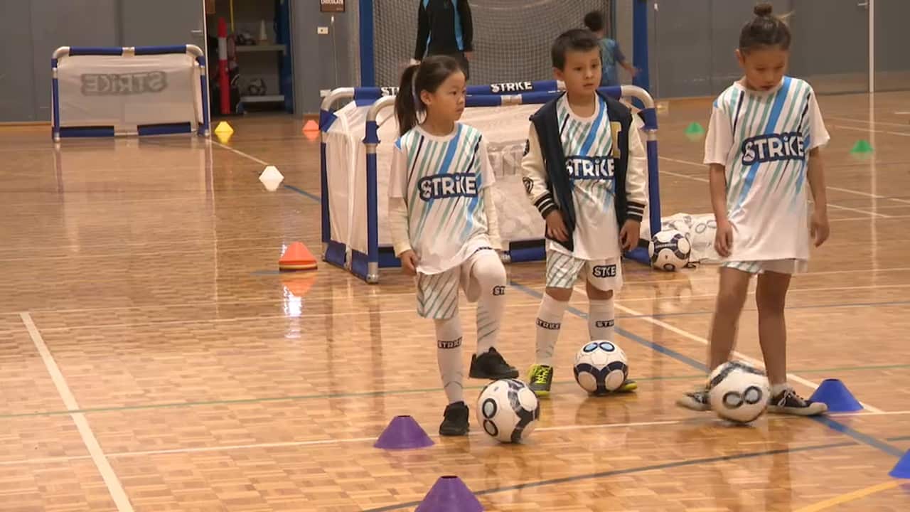 Angela Lee (L) and Jenni Yu (R) at the Hurstville Aquatic Centre football clinic