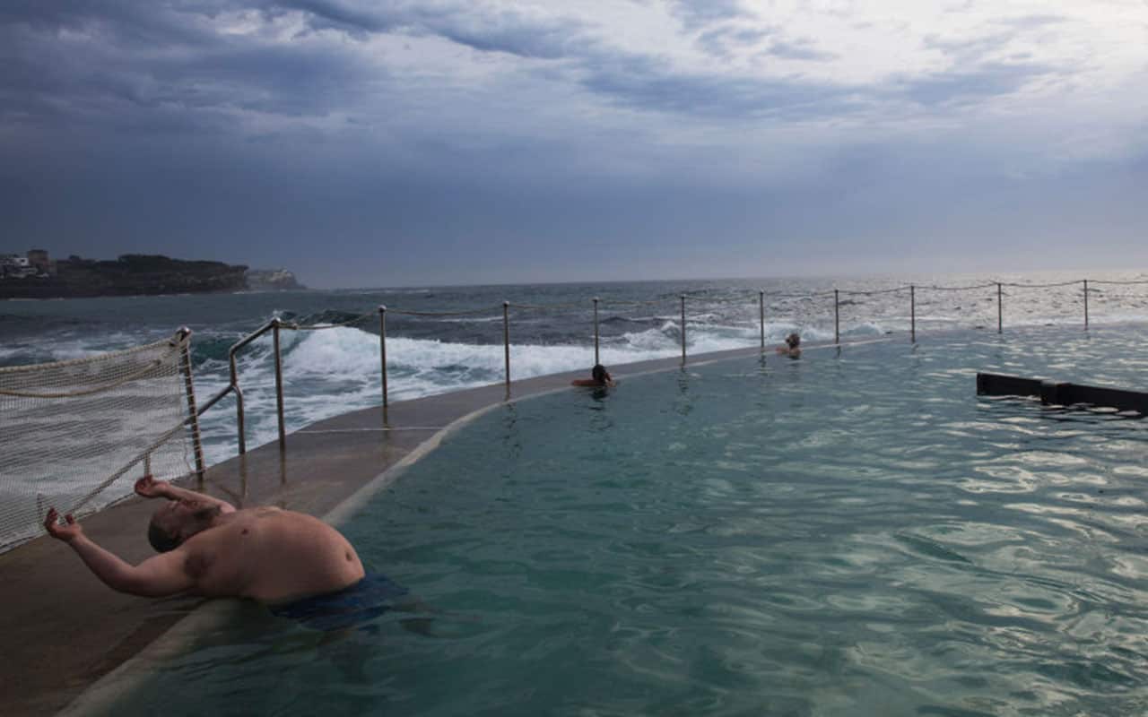 A man stretches himself while taking a swim in the ocean pool at Bronte Beach on December 16, 2017 in Sydney, Australia. 