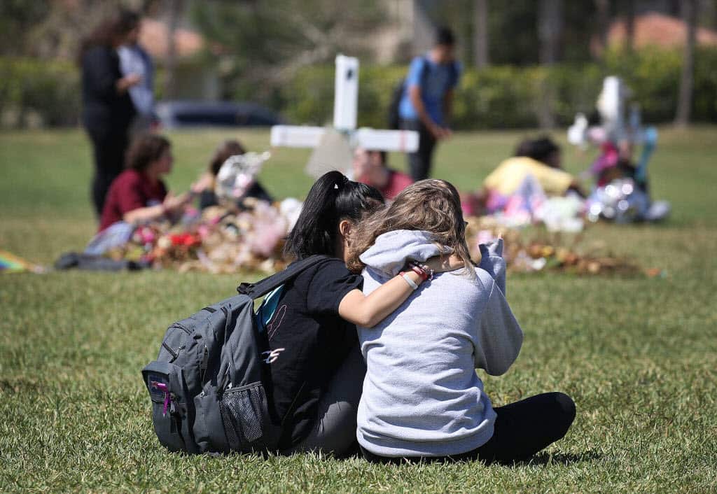 Students honour the memories of 17 classmates and teachers that were killed during the shooting.