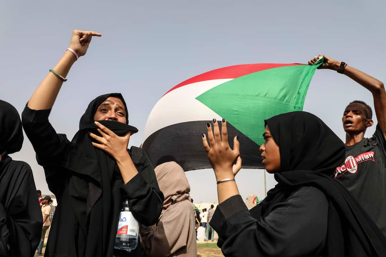 Thousands of Sudanese have joined protests across the capital. But tensions remain high, even as a peace agreement is signed. 