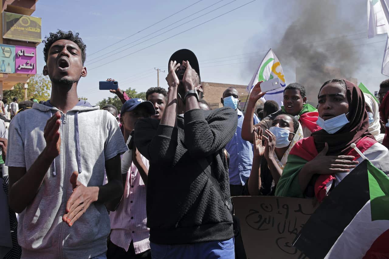 People chant slogans during a protest to denounce the October military coup in Khartoum, Sudan.