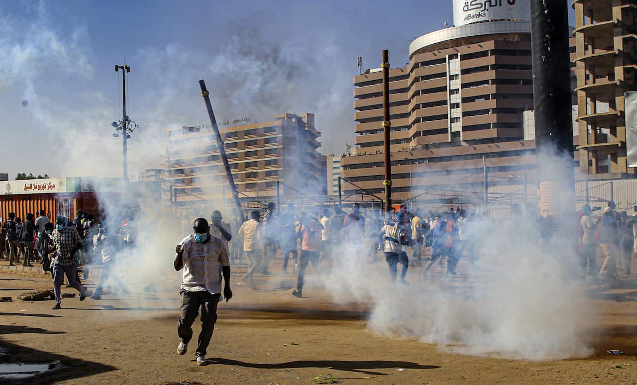 Sudan security forces fire tear gas to disperse anti-coup protesters during a demonstration in Khartoum on 30 November 2021.