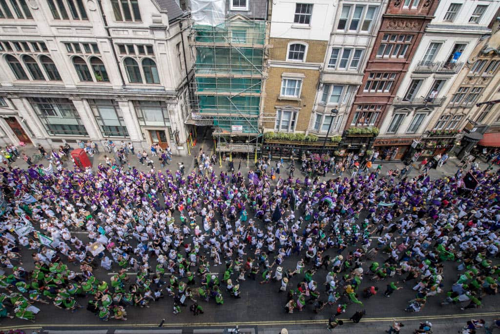 Women and girls in Belfast, Cardiff, Edinburgh and London wore either green, white or violet, the colours of the suffragette movement.