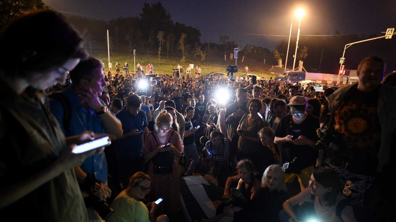 Colleagues and supporters of Ivan Golunov, a journalist who worked for the independent website Meduza gather at a court building in Moscow.