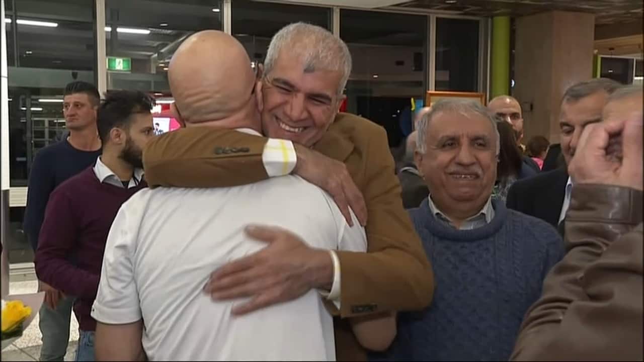 Supporters express their joy at Naim Abbas' return.
