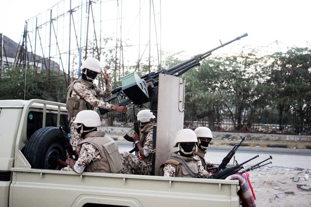 Armed supporters of the separatist Southern Movement patrol a street following clashes in the southern port city of Aden, Yemen, 28 January 2018.