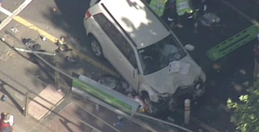 A photo of a crashed car filmed after pedestrians were hit in Melbourne.