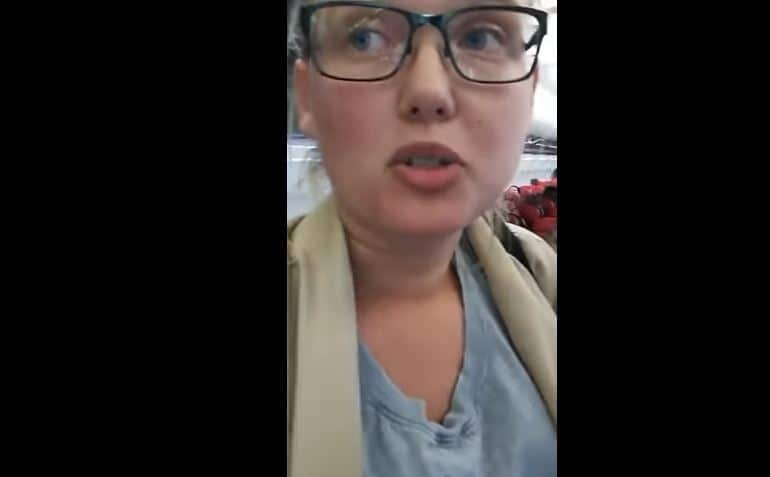 The Swedish woman refused to take her seat, filming the entire stand-off.