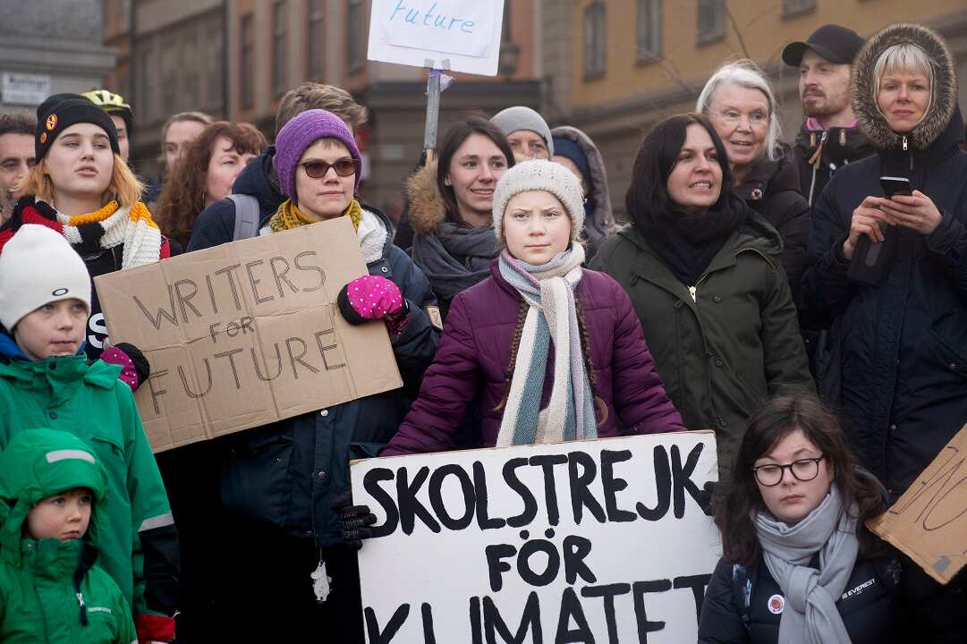 Greta Thunberg, center, during a demonstration calling for climate action at the Swedish Parliament in Stockholm.