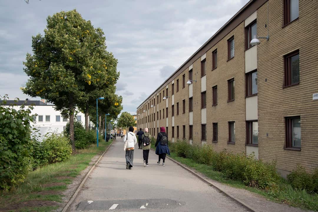 Pedestrians in Rinkeby, a heavily immigrant district of northwest Stockholm, on Aug. 30, 2018.
