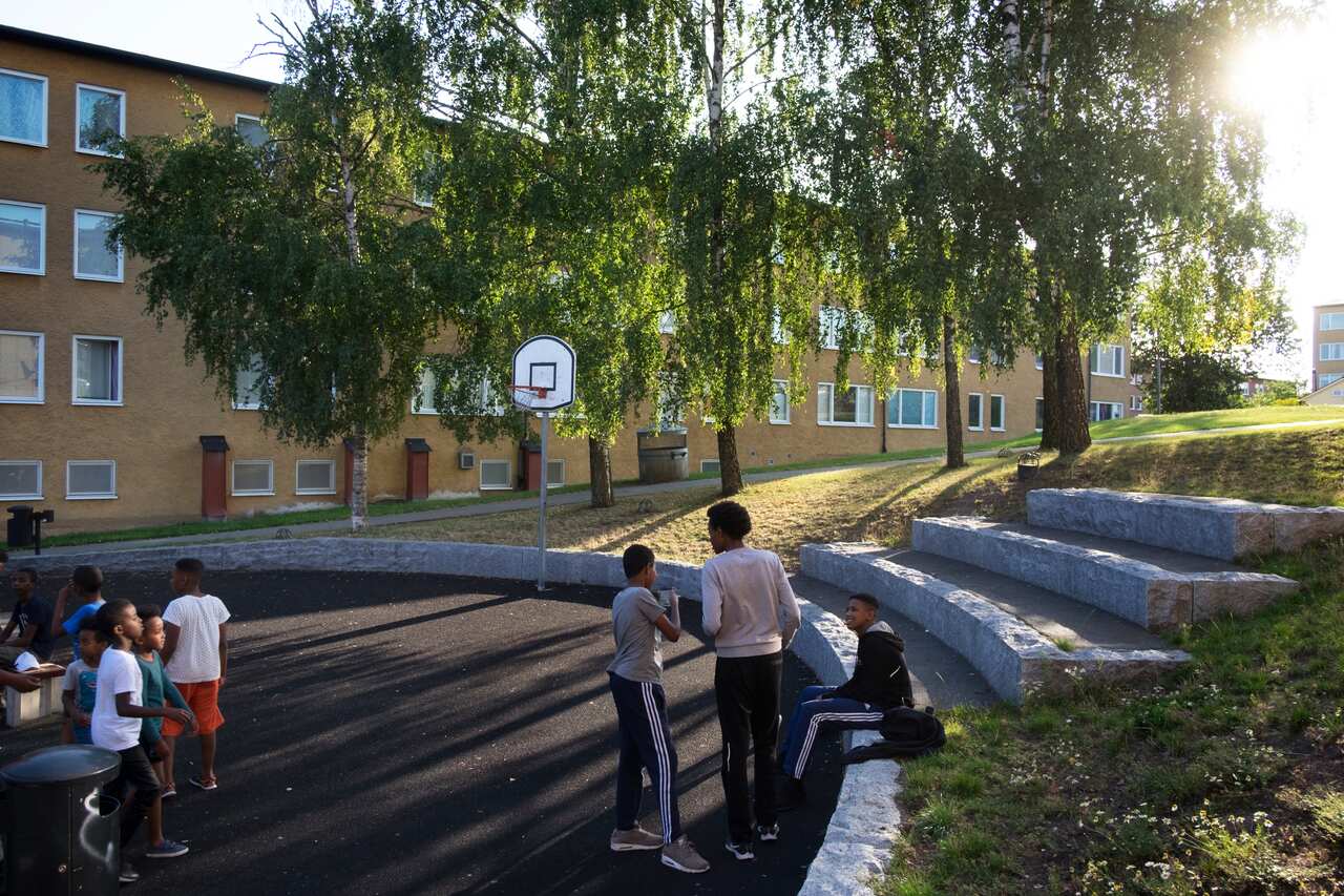 Children play on the courtyards in the Rinkeby district of Stockholm, Sweden, Aug. 7, 2019.