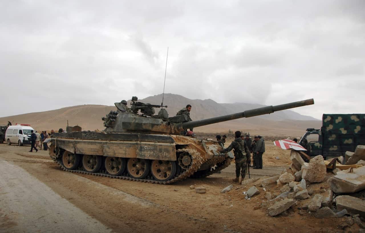 Iraqi forces battling to retake Mosul have cut the last road out of the city, reportedly trapping Islamic State group fighters inside.