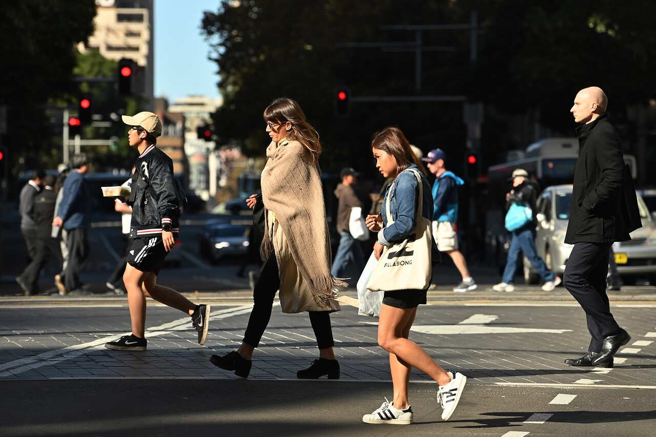 People walking across the road