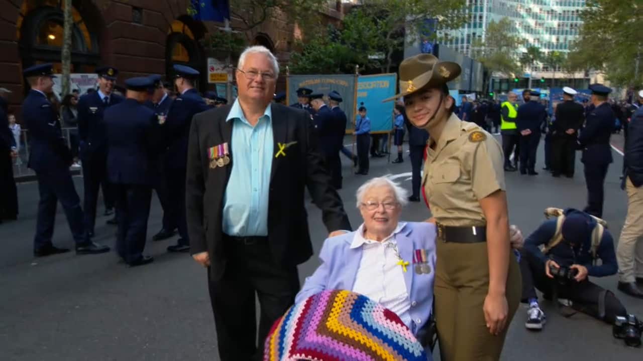 Dorothy Curtis and her son John attend the Sydney Anzac parade. 