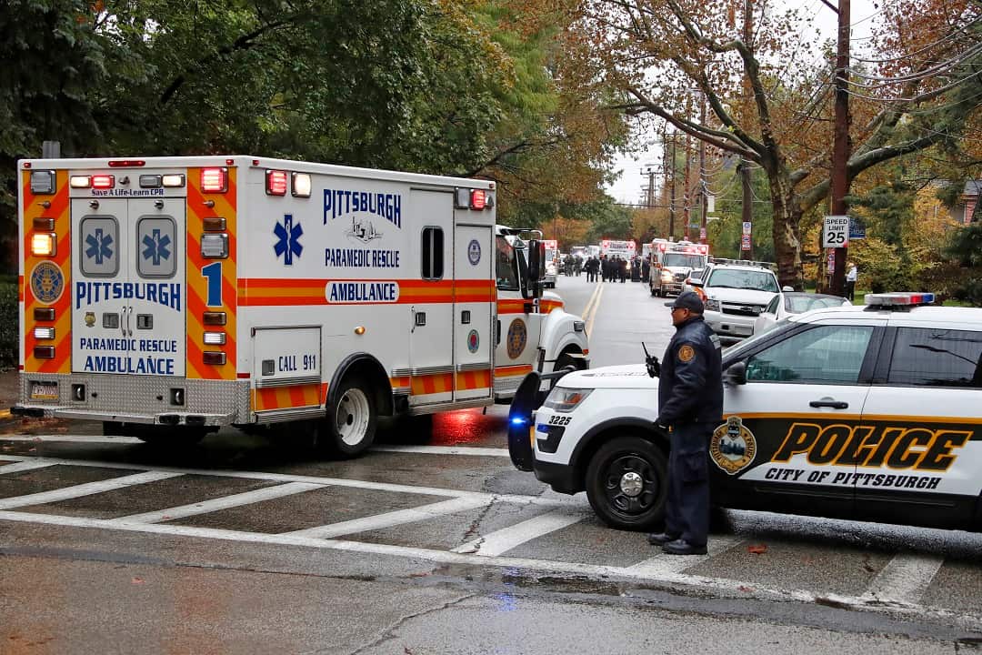 An ambulance arrives at the Tree of Life Synagogue where a shooter opened fire Saturday, Oct. 27, 2018, injuring multiple people, including three police officers.(AP Photo/Gene J. Puskar)